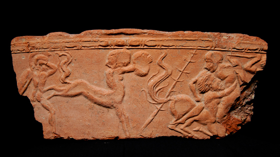A terracotta decoration from Insula IV depicts a battle featuring centaurs, the half-man, half-horse mythological figures of Greco-Roman mythology.