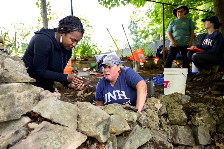 Historian Kabria Baumgartner and archaeologist Meghan Howey at the possible site of Pompey's homestead