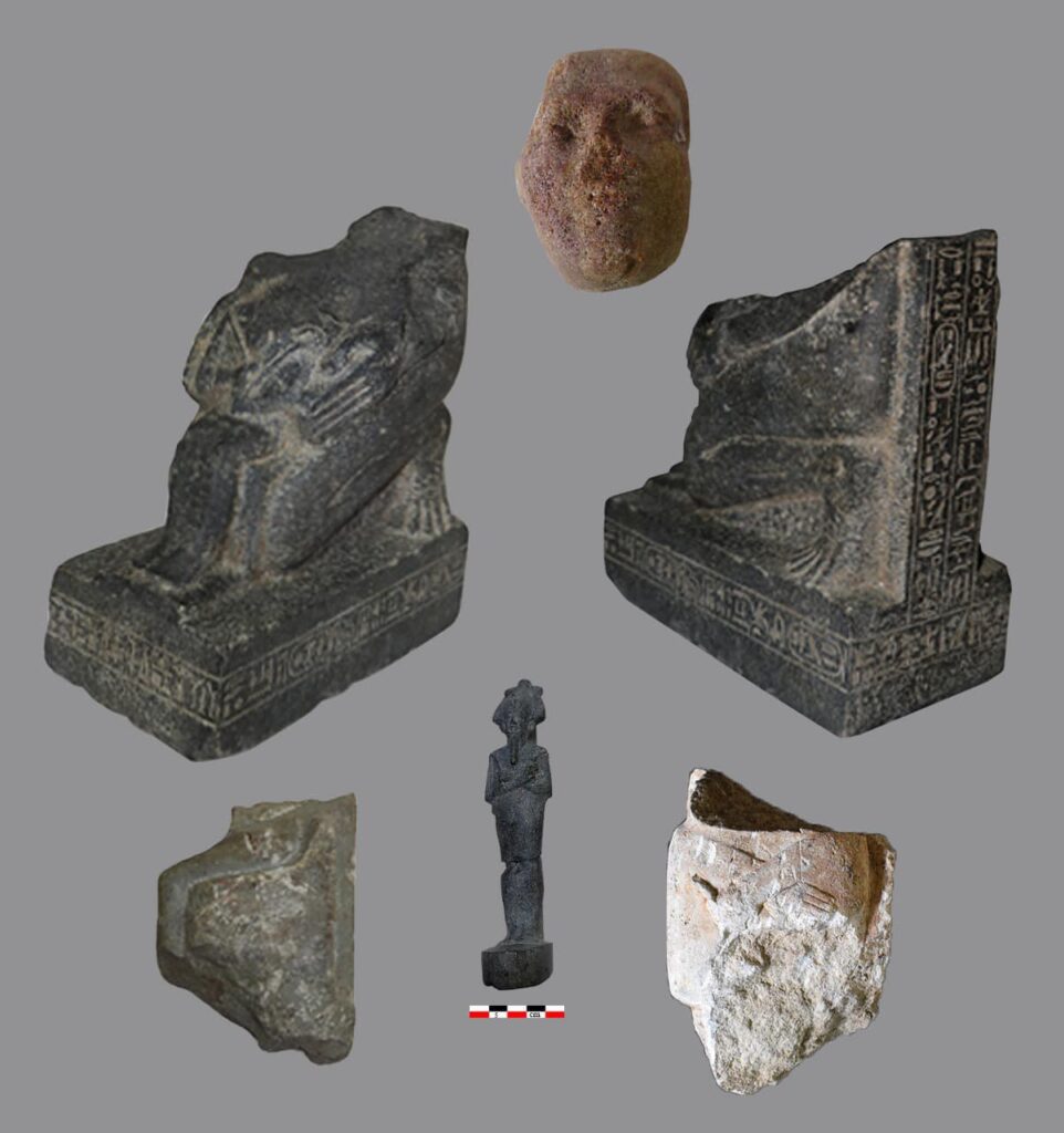 Fragmented statue and other sculptures recovered at Tel el-Fareen, Egypt