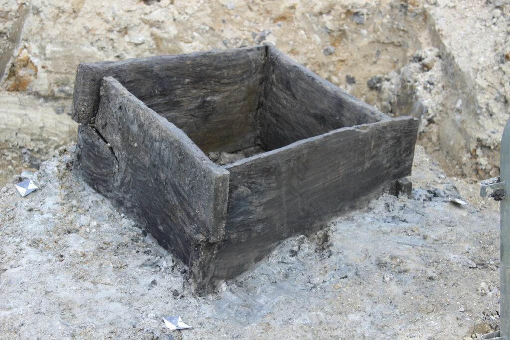 Wooden board structure at the base of the Roman well