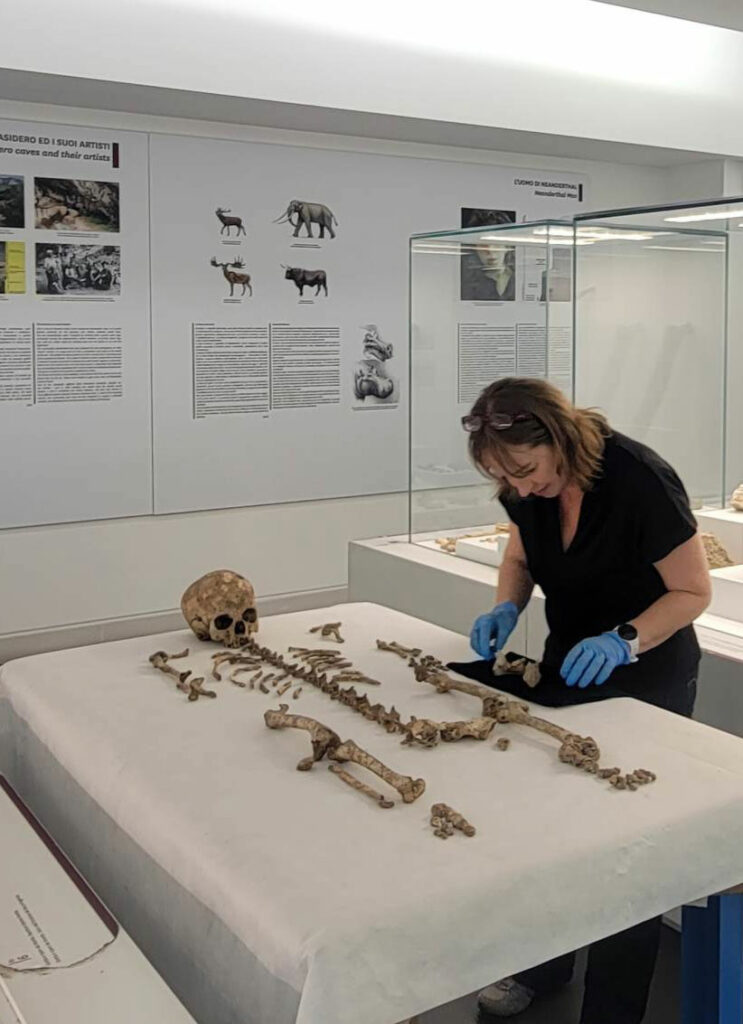 Dr. Mary Lewis from the University of Reading inspects the skeletal remains of Romito 2 found in southern Italy