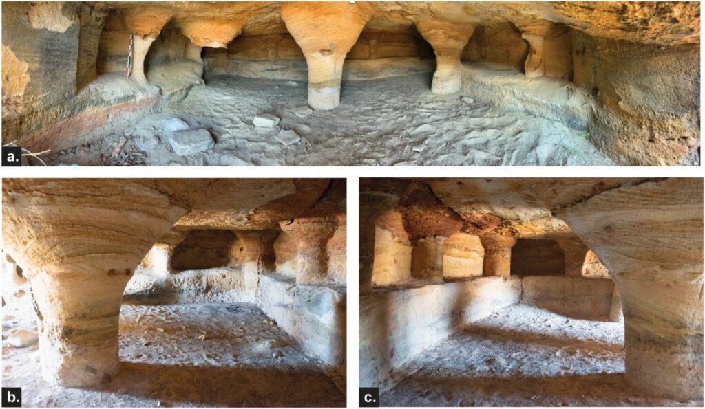 Rock-cut chamber at Teniky with benches and central pillar