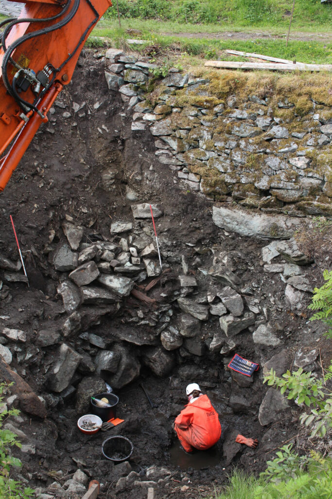 Osteoarchaeologist Hanne Ekstrom Jordahl collects the human remains from the well