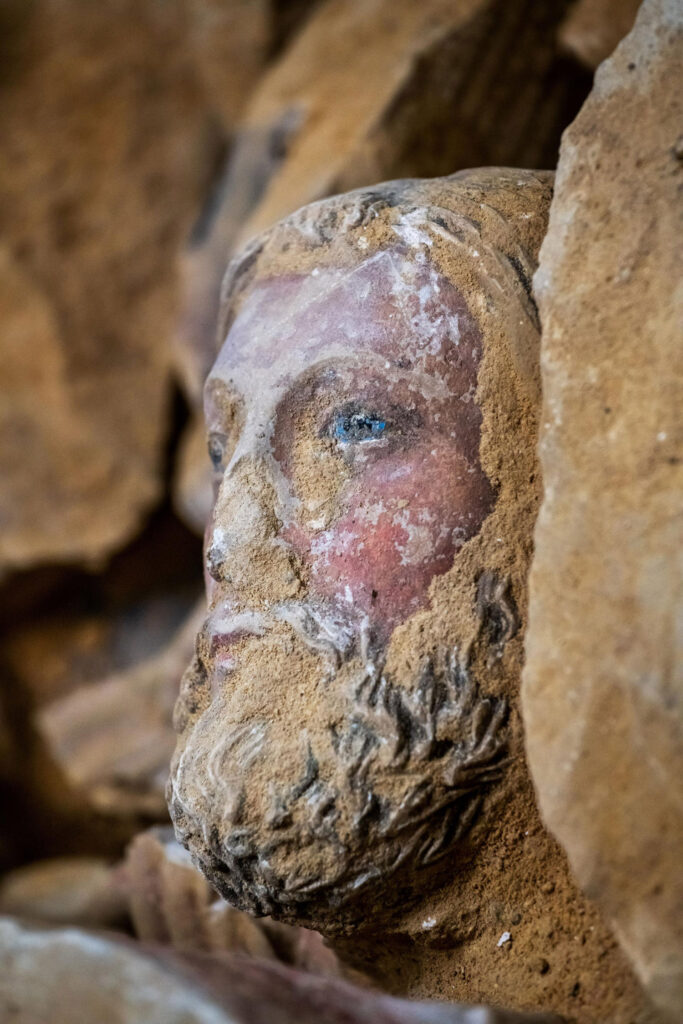 Painted sculptural head from Notre Dame's 13th-century rood screen, which was destroyed and buried in the 18th century and unearthed in 2022