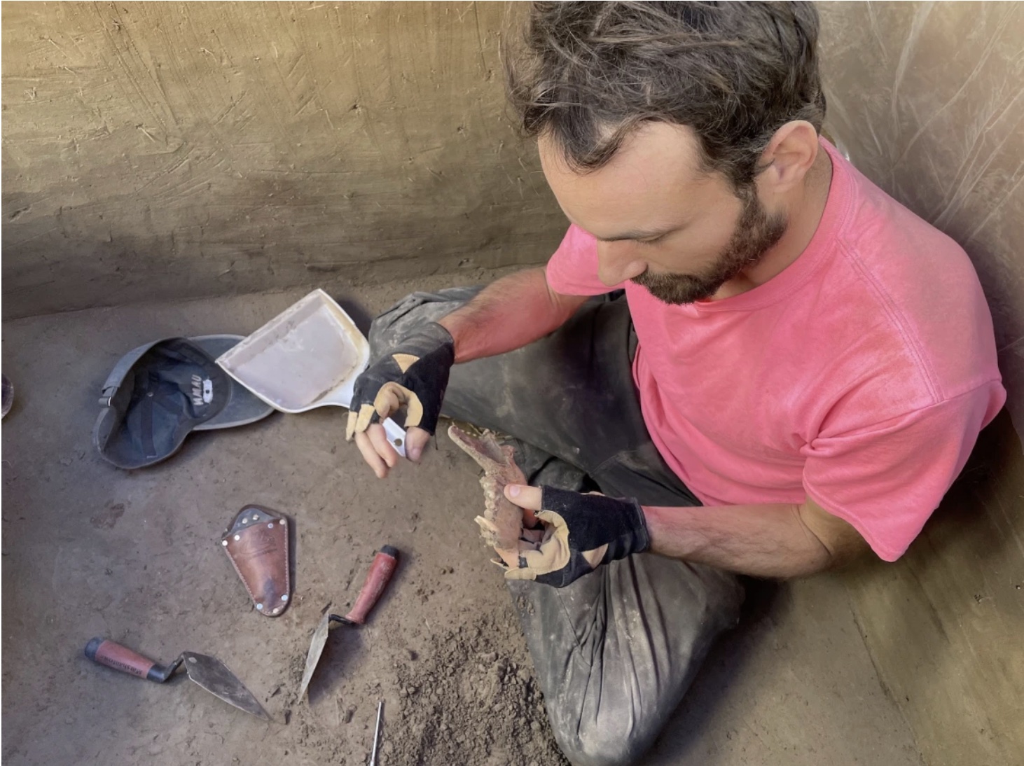 François Lanoë after unearthing an 8,100-year-old canine jawbone in interior Alaska