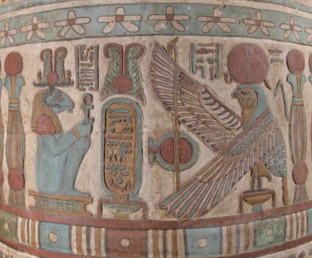 A painted relief on a column inside the hall features an oval cartouche containing the name of the Roman emperor Hadrian flanked by Khnum, depicted as a ram, and Behedety, the falcon god of the midday sun