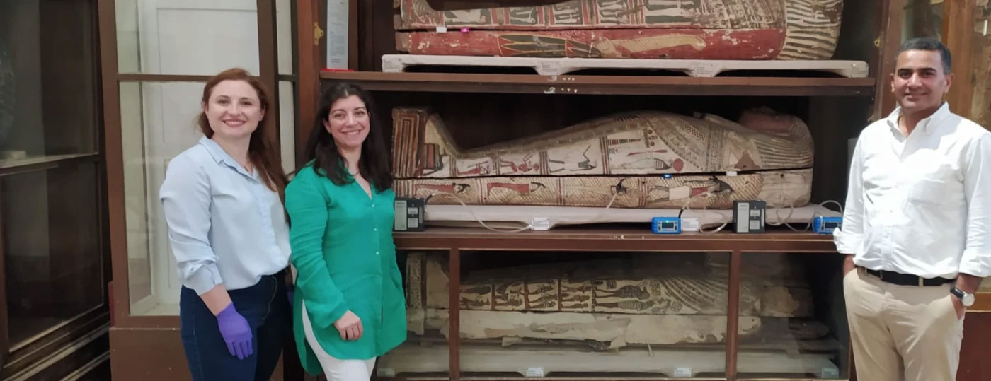 Researchers Emma Paolin, Cecilia Bembibre, and Abdelrazek Elnaggar with sarcophagi from the Egyptian Museum in Cairo