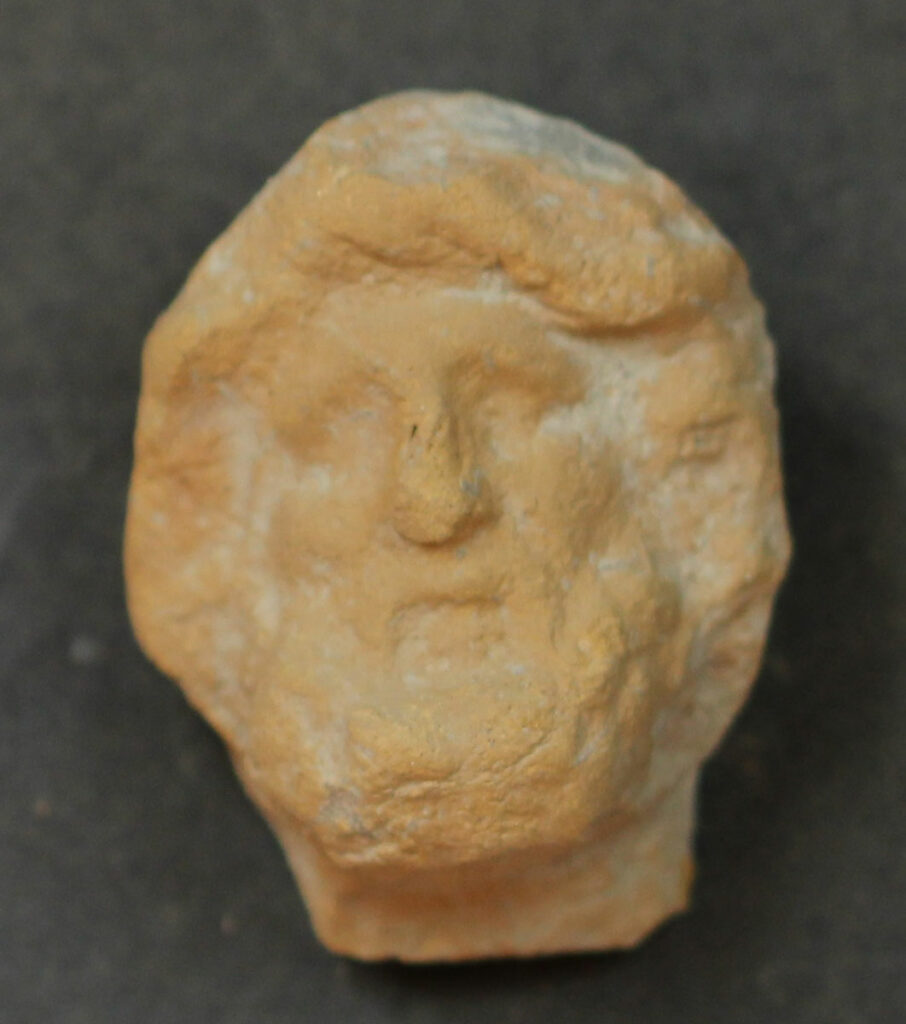 Clay head of Asclepius