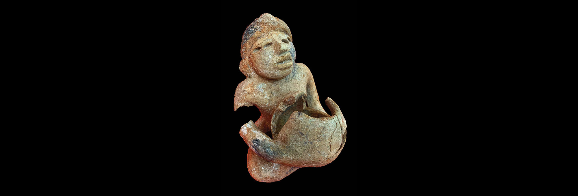 Artifacts - Maya Ceramic Figurine - Archaeology Magazine - July