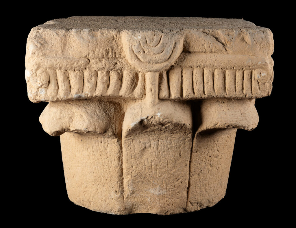 Stone column capital with carved menorah