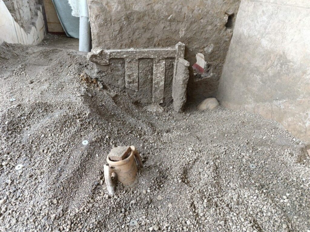 Bed frame buried in lapilli, House of Helle and Phrixus, Pompeii, Italy