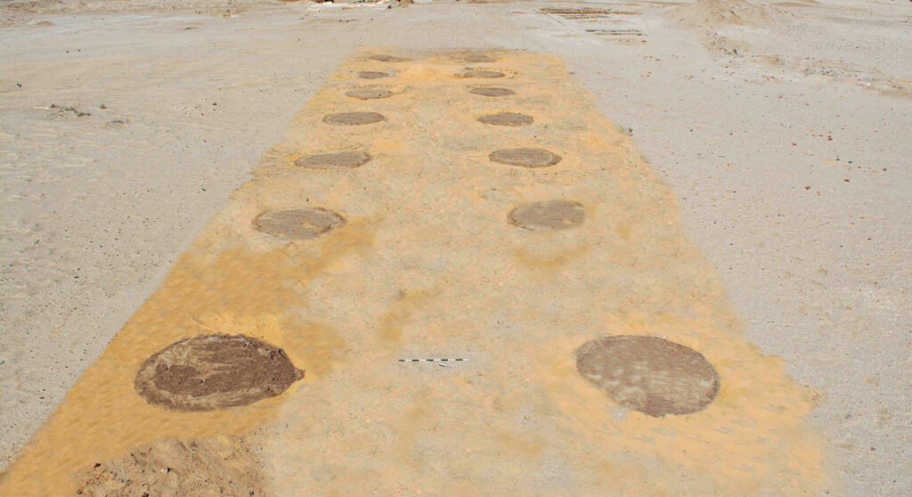 Street lined with clay pits, Tell Abu Saifi, Egypt