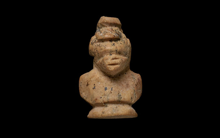 Carved head of African figure