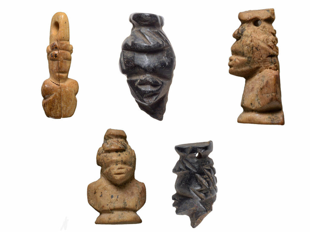 Heads of carved African figures