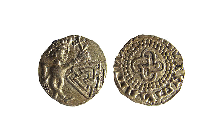 Obverse and reverse of Anglo-Saxon gold coin featuring an image of a dancing man holding a cross