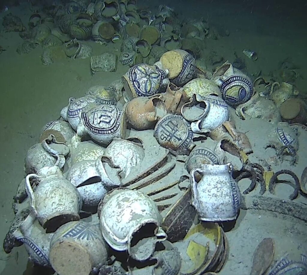 Jugs with "IHS" monogram on the seafloor