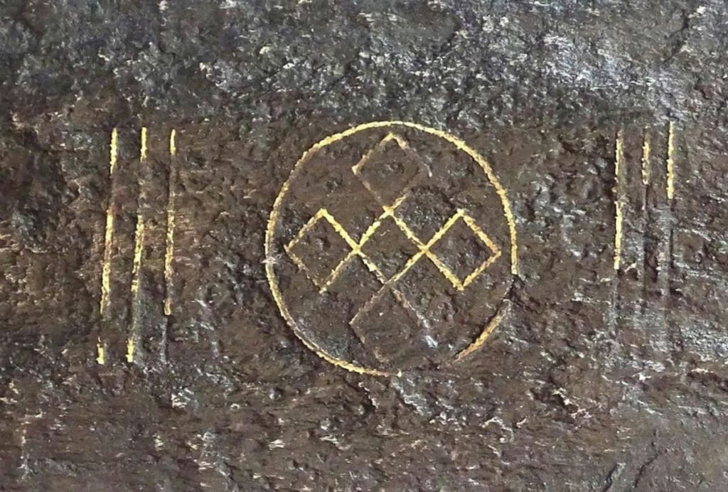 Detail of the sword's blade with showing endless knot symbol
