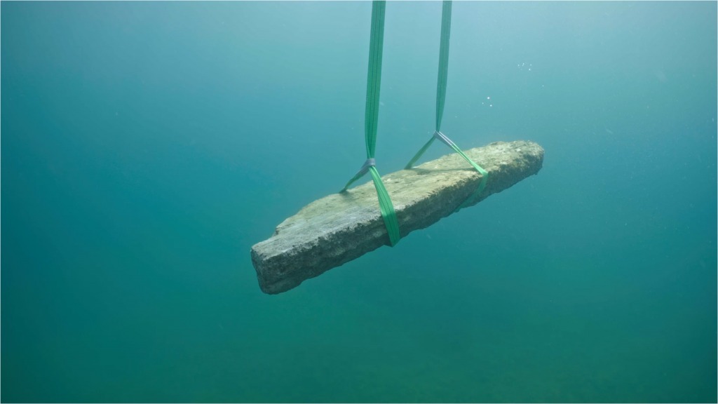 A Roman marble slab is lifted off the seafloor at the ancient harbor of Misenum on Italy's Bay of Naples.