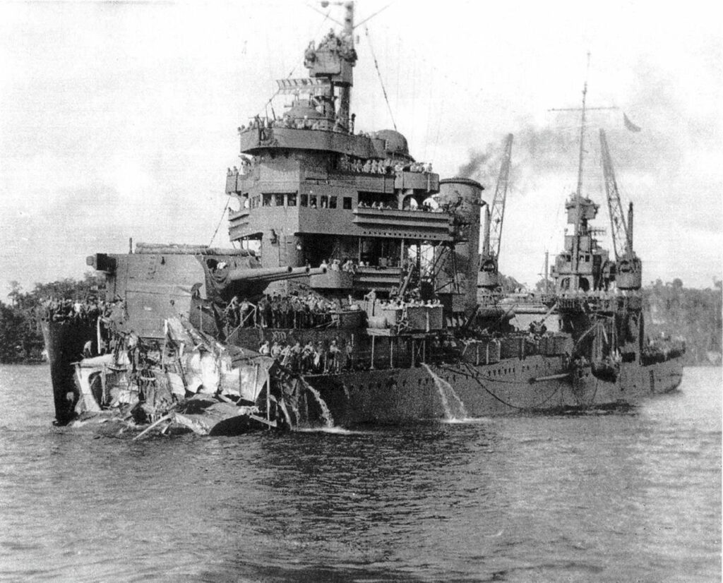 Archival photo of USS New Orleans in Tulagi Harbor, missing its bow after the explosion