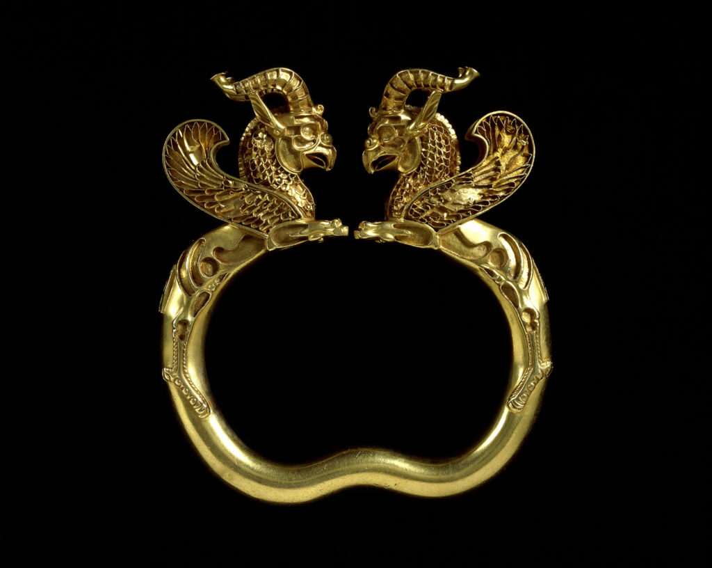 Gold armlet with griffin head finials