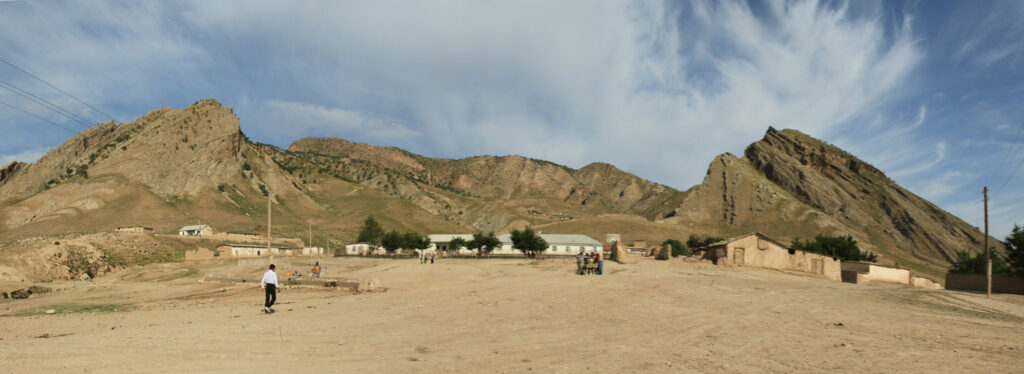 View of the village of Torbulok, Tajikistan, with the village school at center
