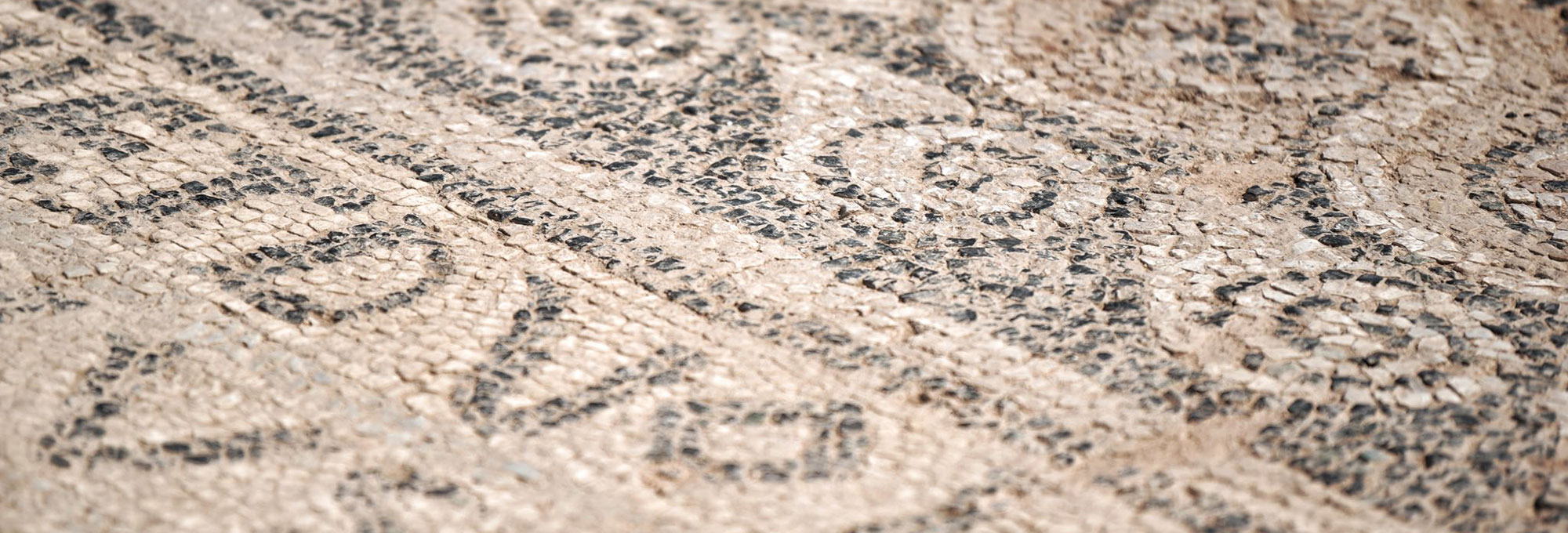 Detail of mosaic inscription, Ulpiana Archaeological Park, Kosovo