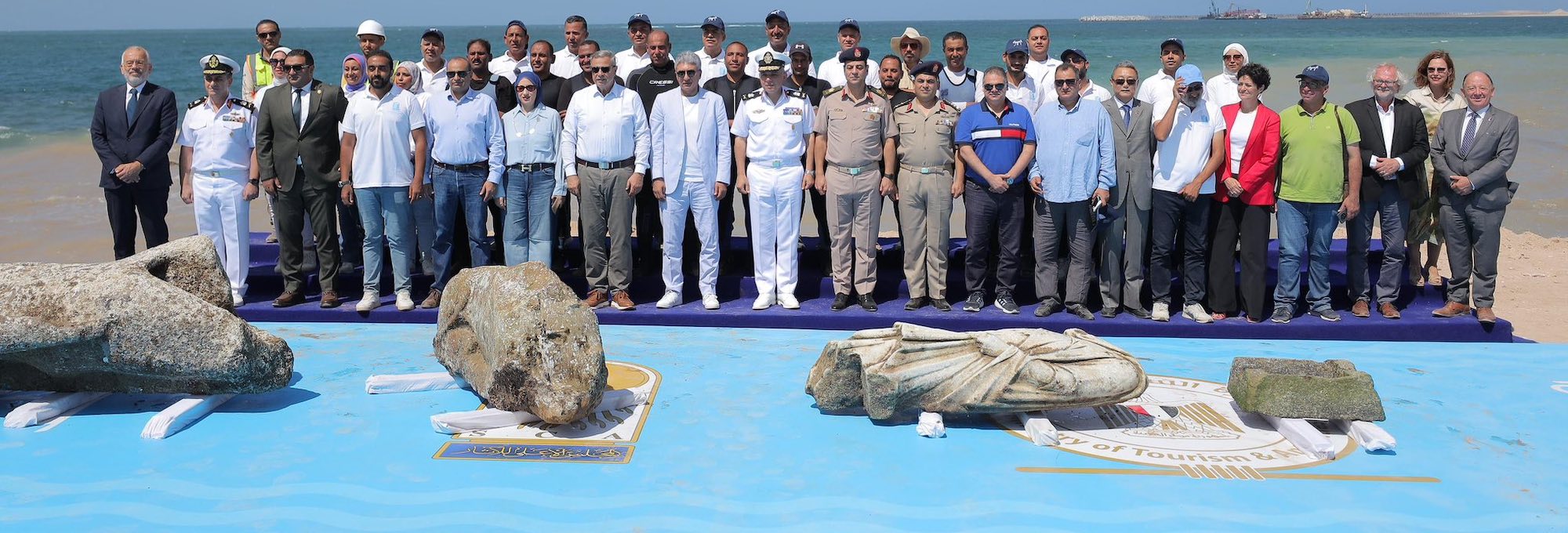 Officials from the Egyptian Navy and Ministry of Tourism and Antiquities pose with the raised statuary, Abu Qir, Egypt