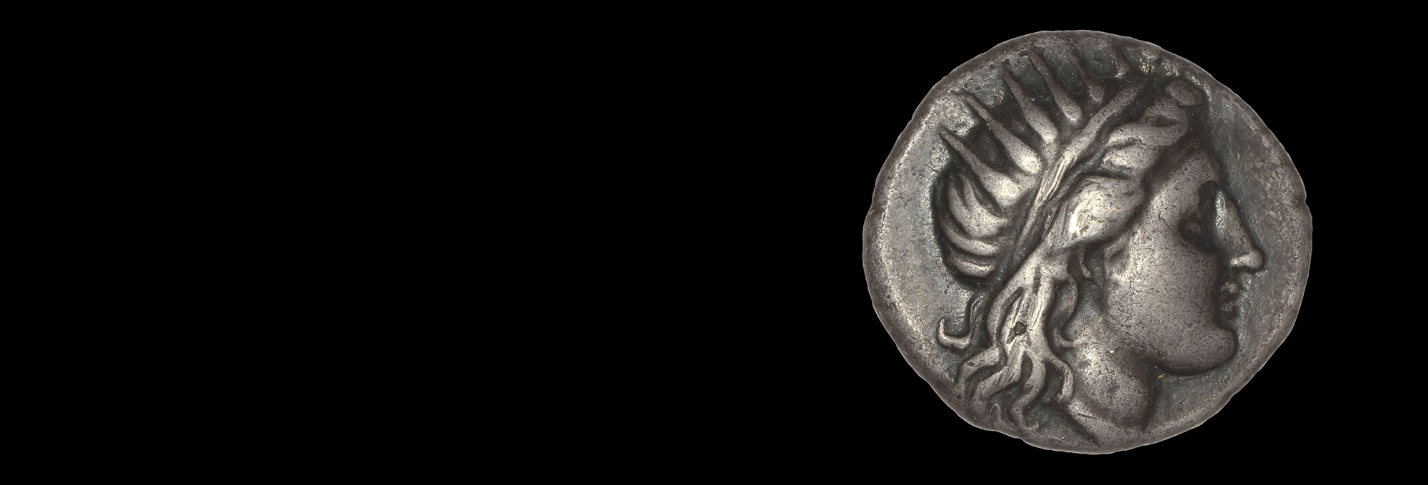 Coin showing Helios in profile wearing a radiate crown