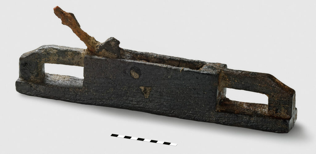 Wooden plane with inset iron blade