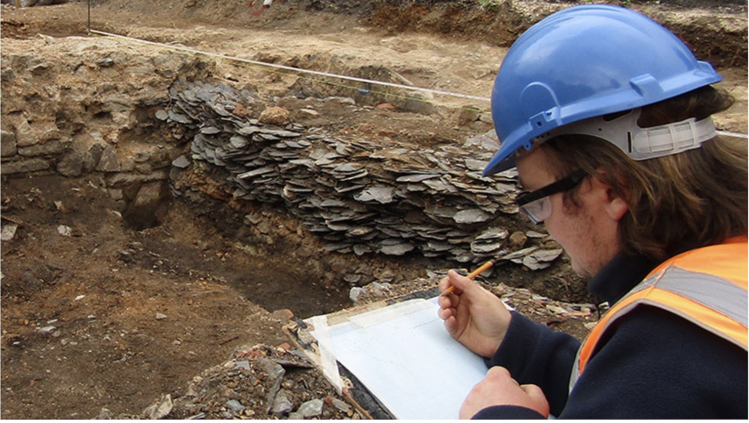 An archaeologist documents the market square excavation in Leicester, England.
