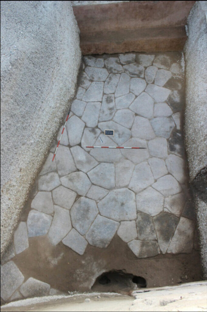 Overhead view of waiting room pavement and bench in the Villa of the Mysteries, Pompeii, Italy