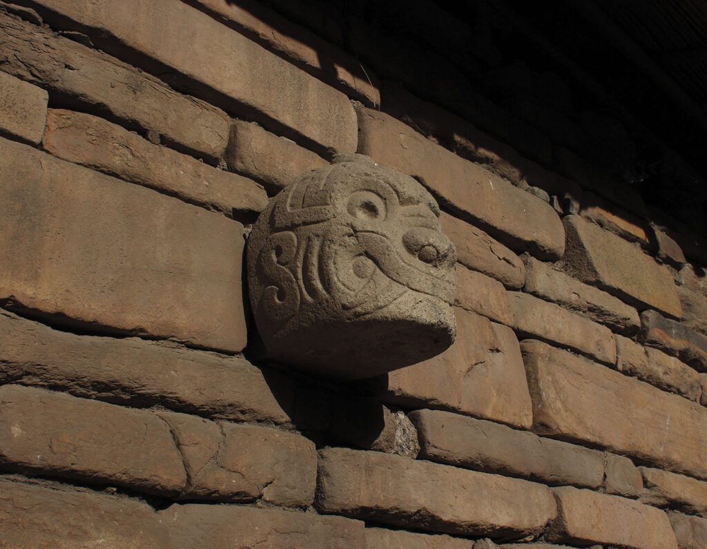 A temple wall at Chavin de Huantar displays a disembodied head.