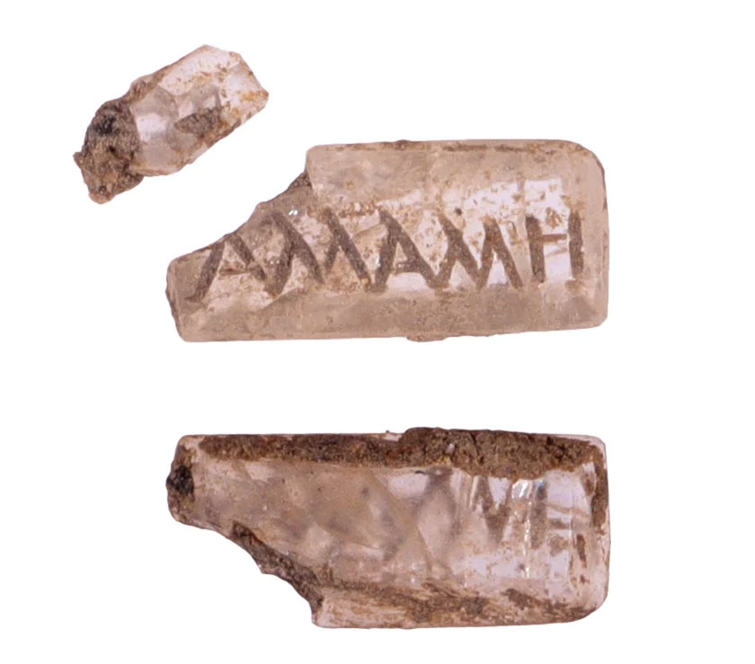 This rock crystal intaglio engraved with a name in Greek was probably mounted on a gold ring discovered nearby.