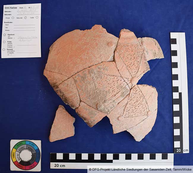 Pottery fragment with carved, cross-shaped decoration