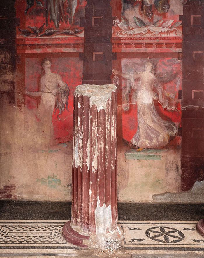 Frescoed panels in the House of the Thiasus portray a satyr (left) and a woman (right)
