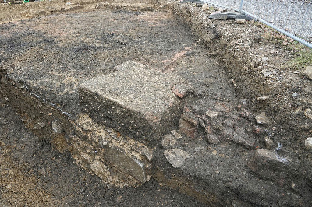 A large limestone block at the center of the Weiherhaus in Gelterkinden, Switzerland, was the base of a post or a masonry column.
