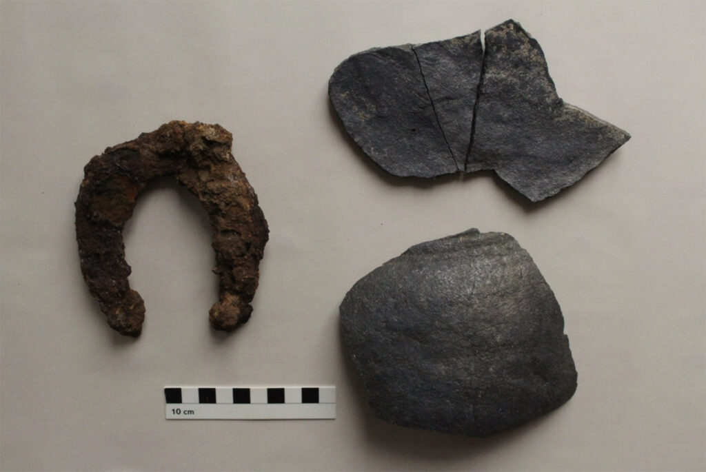 Medieval horseshoe and ceramic fragments