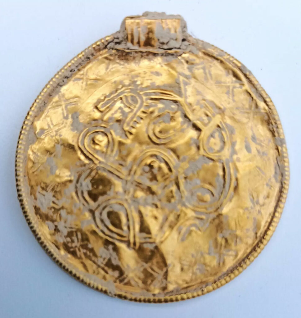 Gold pendant with runic inscription