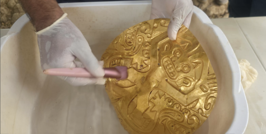 Gold pectoral during cleaning