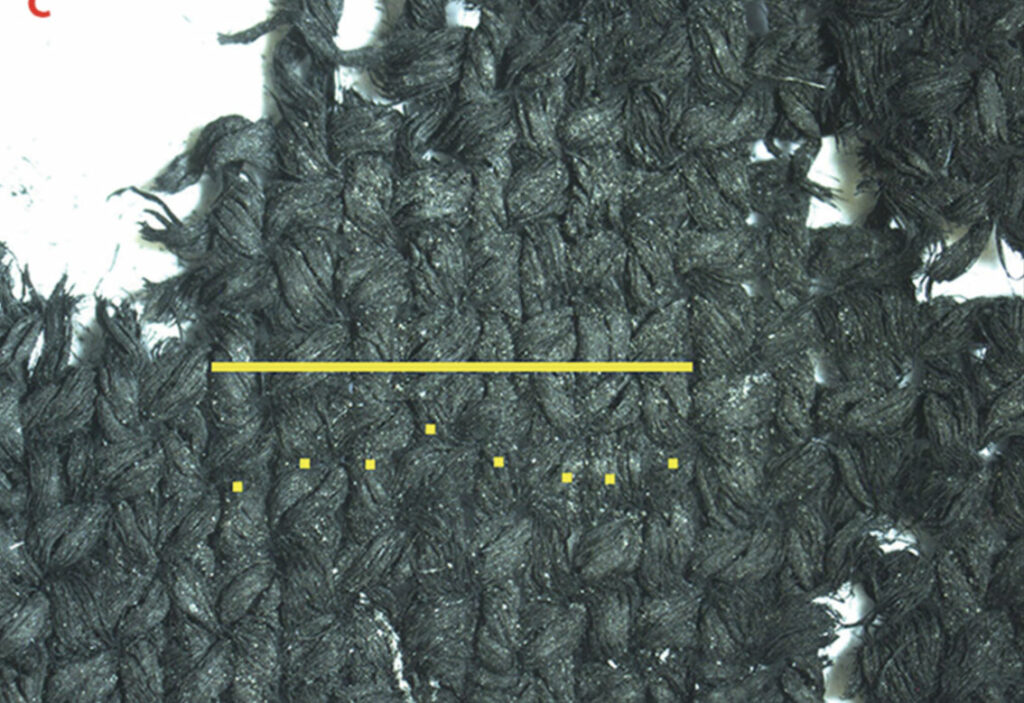 Fragment of indigo-dyed woven fabric