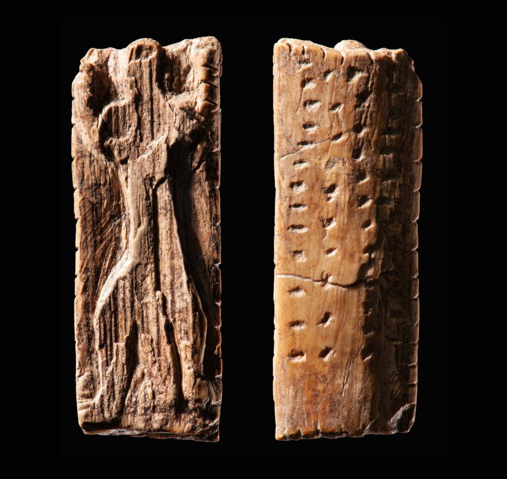 The Adorant figurine from Germany's Geißenklösterle Cave is approximately 40,000 years old and consists of a small ivory plate bearing an anthropomorphic figure and multiple sequences of notches and dots.