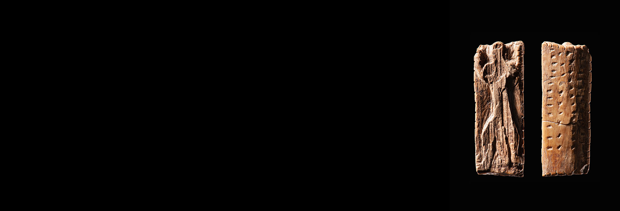 Small ivory figurine incised with dots and notches