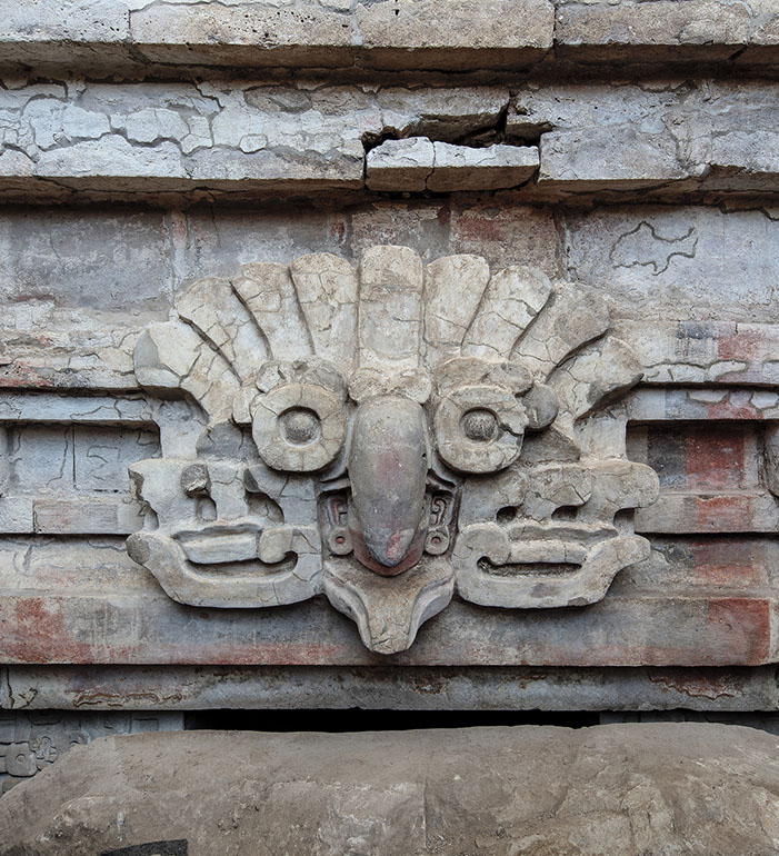 Stucco owl headdress relief