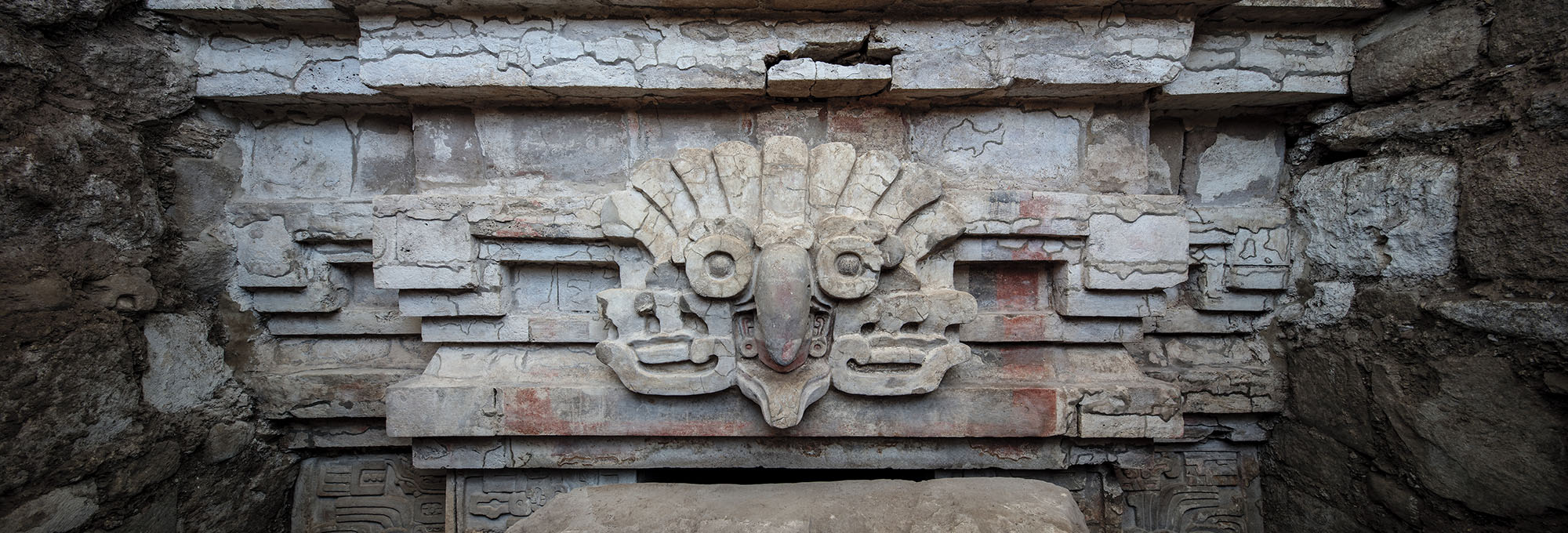 Stucco owl headdress relief