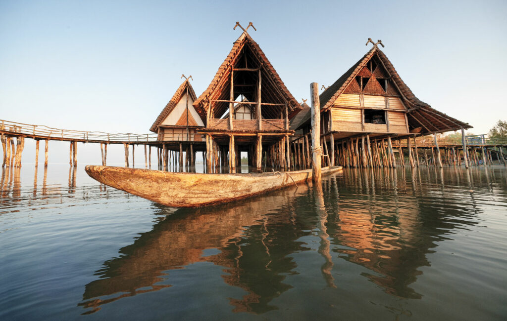 Modern replicas of Bronze Age houses stand in Lake Constance