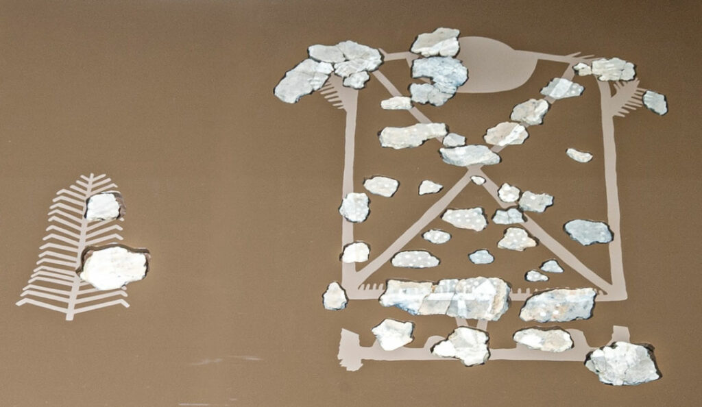 A fragmented wall painting found in Lake Constance near Unteruhldingen depicting faceless female forms thought to represent ancestors of the pile house dwellers