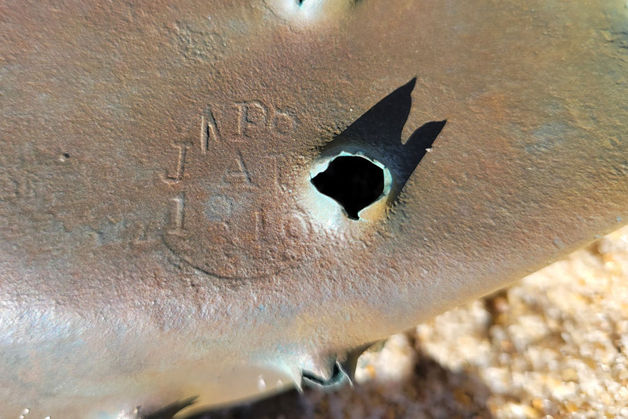Stamp reading January 1810 on piece of copper sheathing