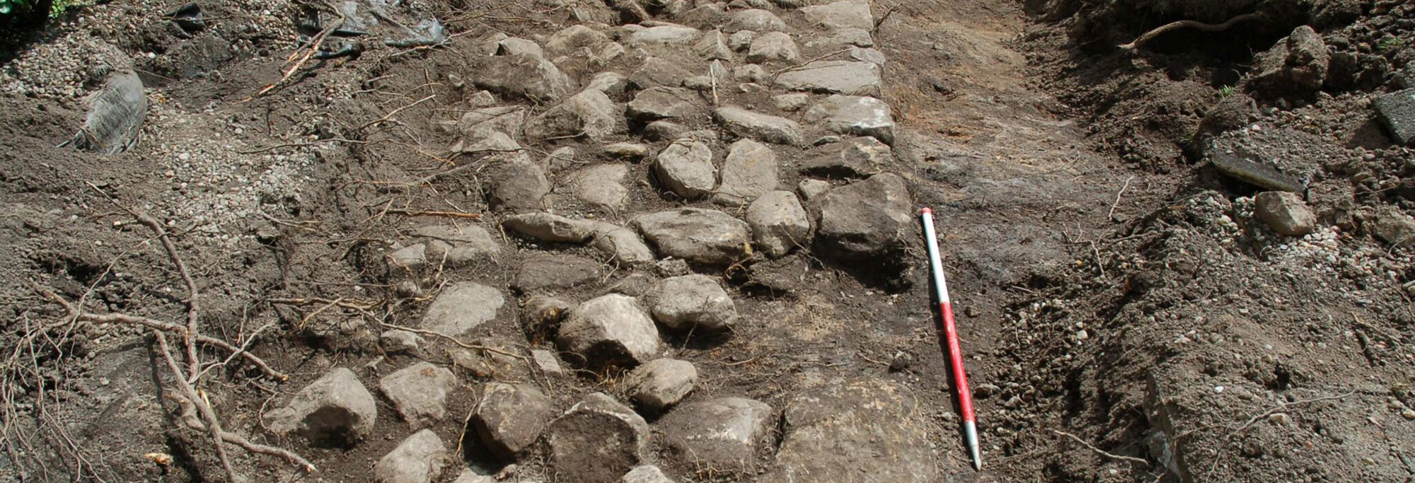Linear kerbed stone base discovered in the back gardens of Bearsden, Scotland