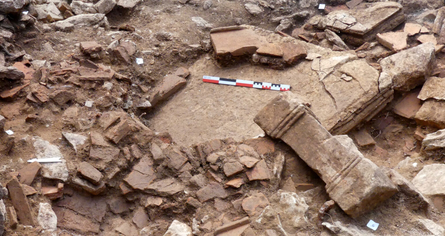 Pedestal and large stone table during excavation, Mancey, France