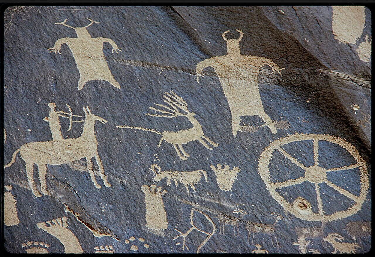 A petroglyph from Newspaper Rock along Indian Creek in southeastern Utah shows a warrior atop a horse using a bow.